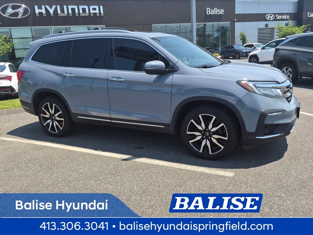 2022 Honda Pilot Touring 7 Passenger in Blue — front three-quarter view